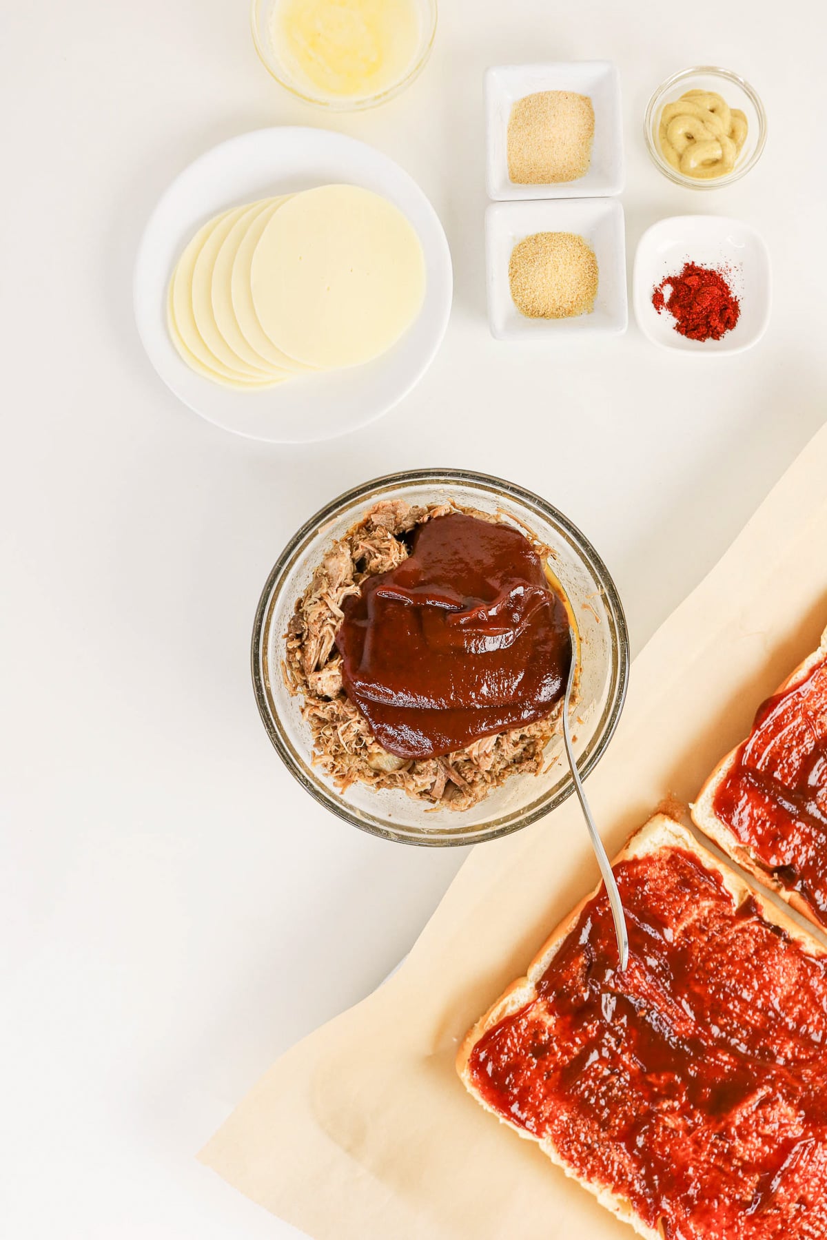 Pulled pork and bbq sauce in small glass bowl.