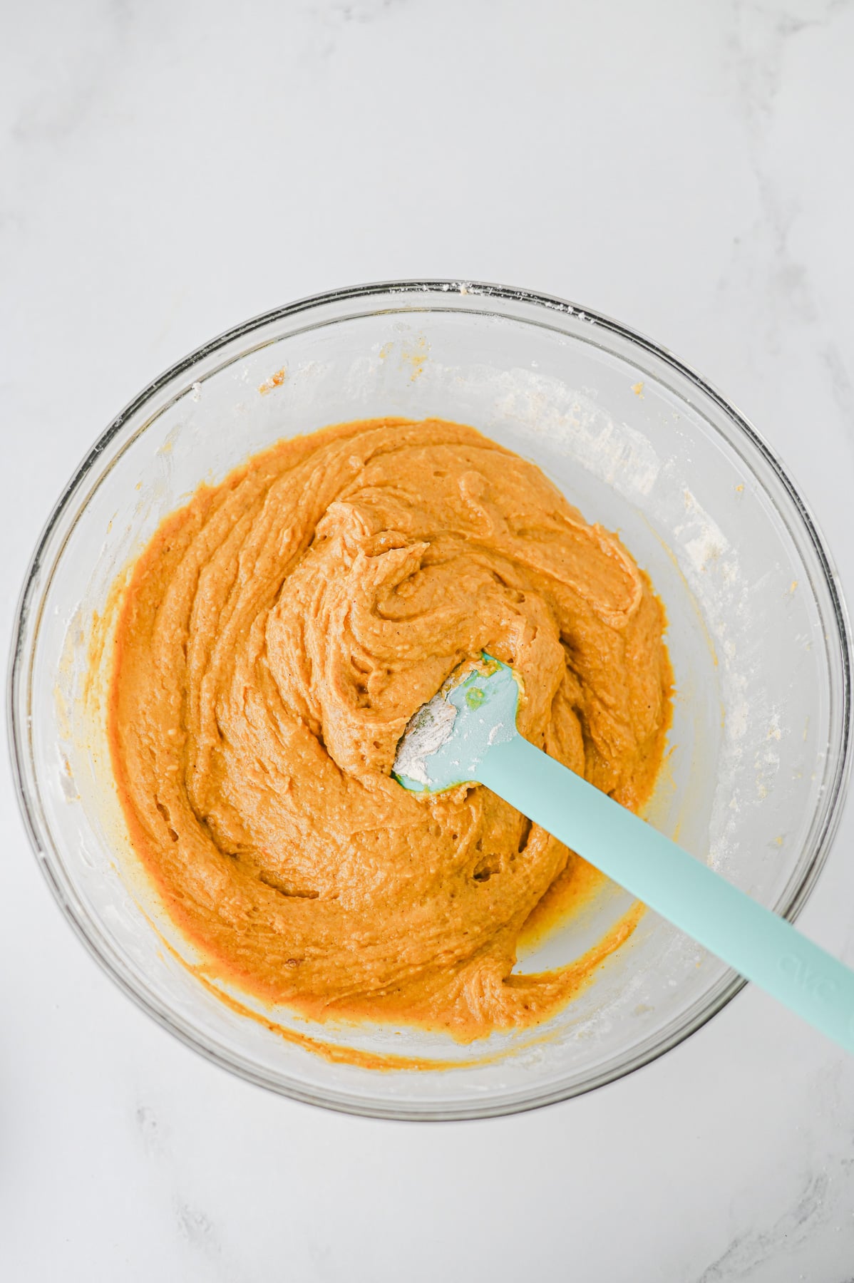 Pumpkin puree, brown sugar, vegetable oil, maple syrup, and milk in mixing bowl.