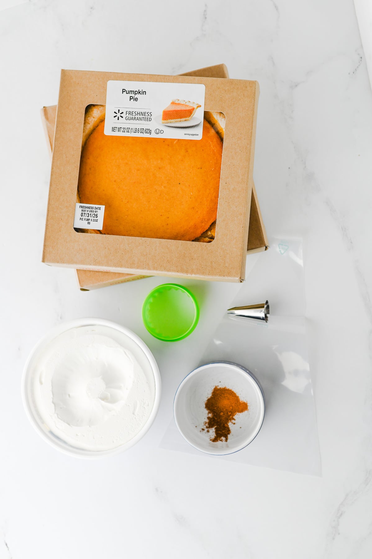 Ingredients for pumpkin pie bites on kitchen counter in preparation to make a cozy fall dessert.