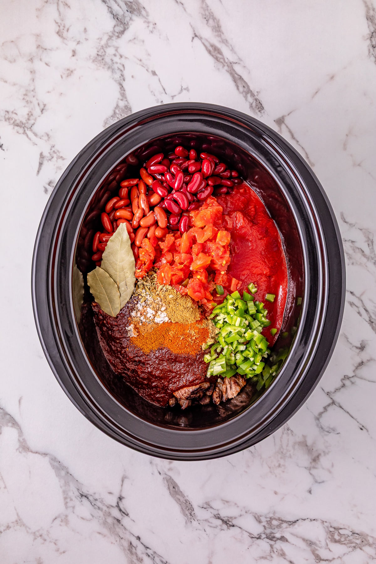 Remaining ingredients are added to the crockpot.