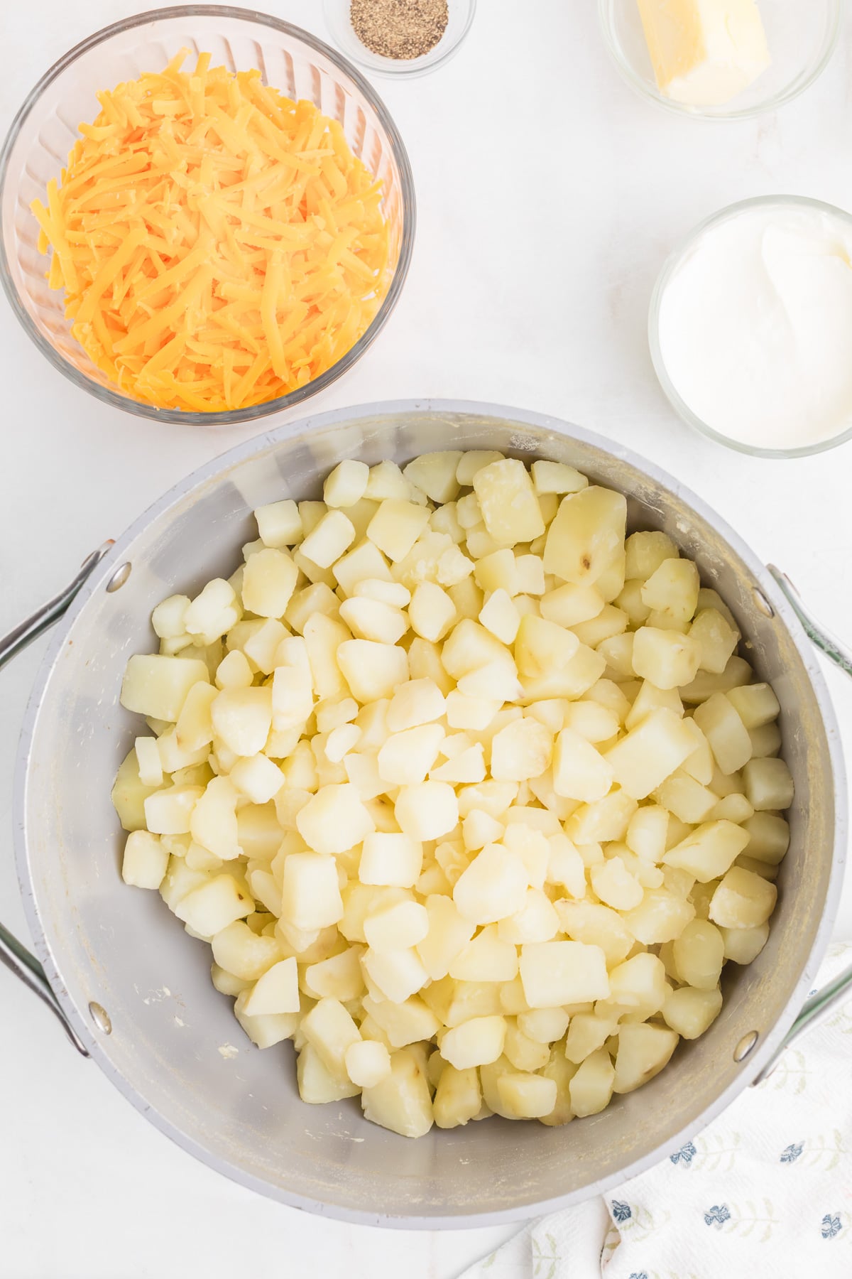 Cubed potatoes in pot of boiling water.