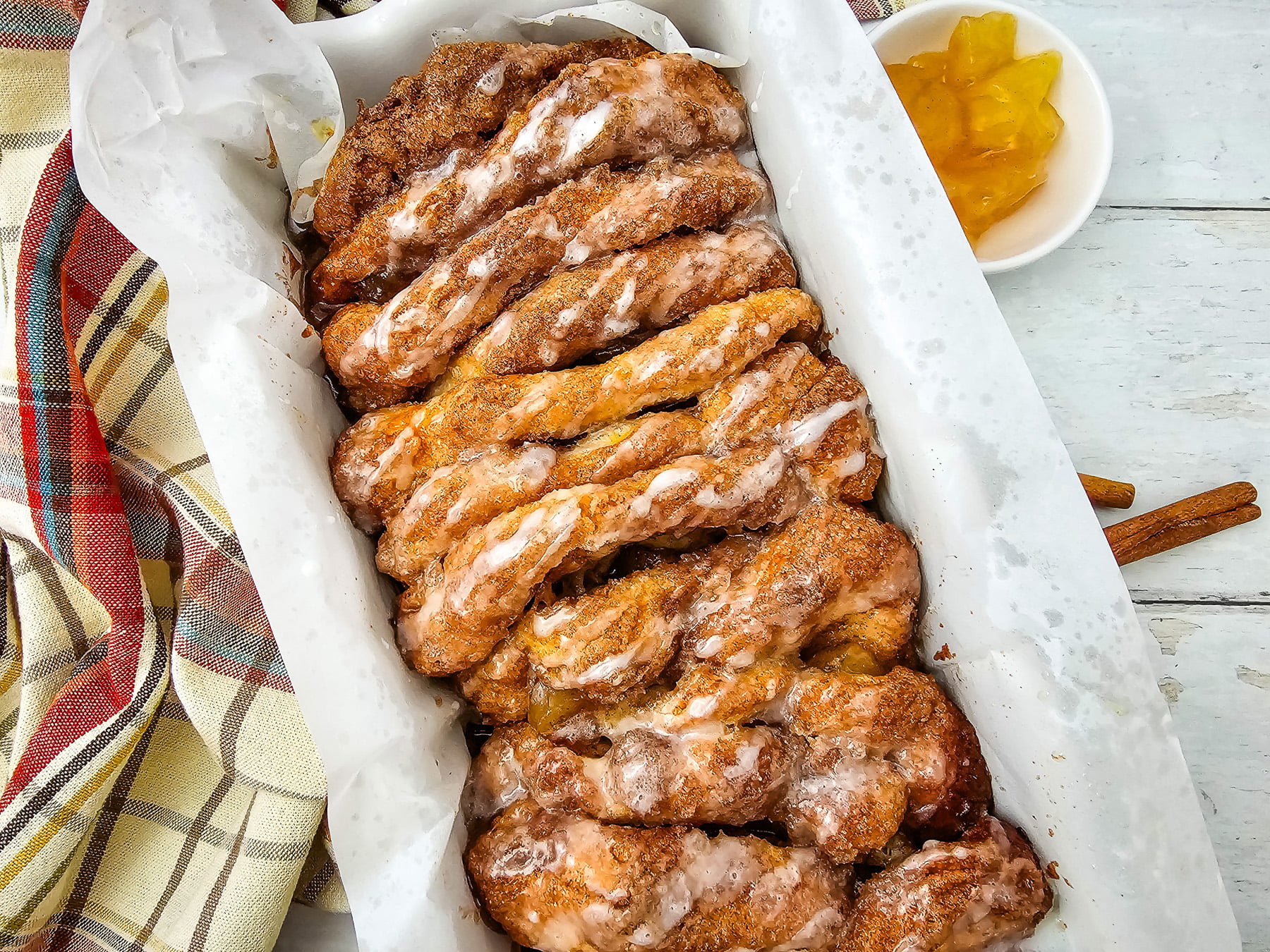 Apple cinnamon biscuit loaf in loaf pan, ready to be served.