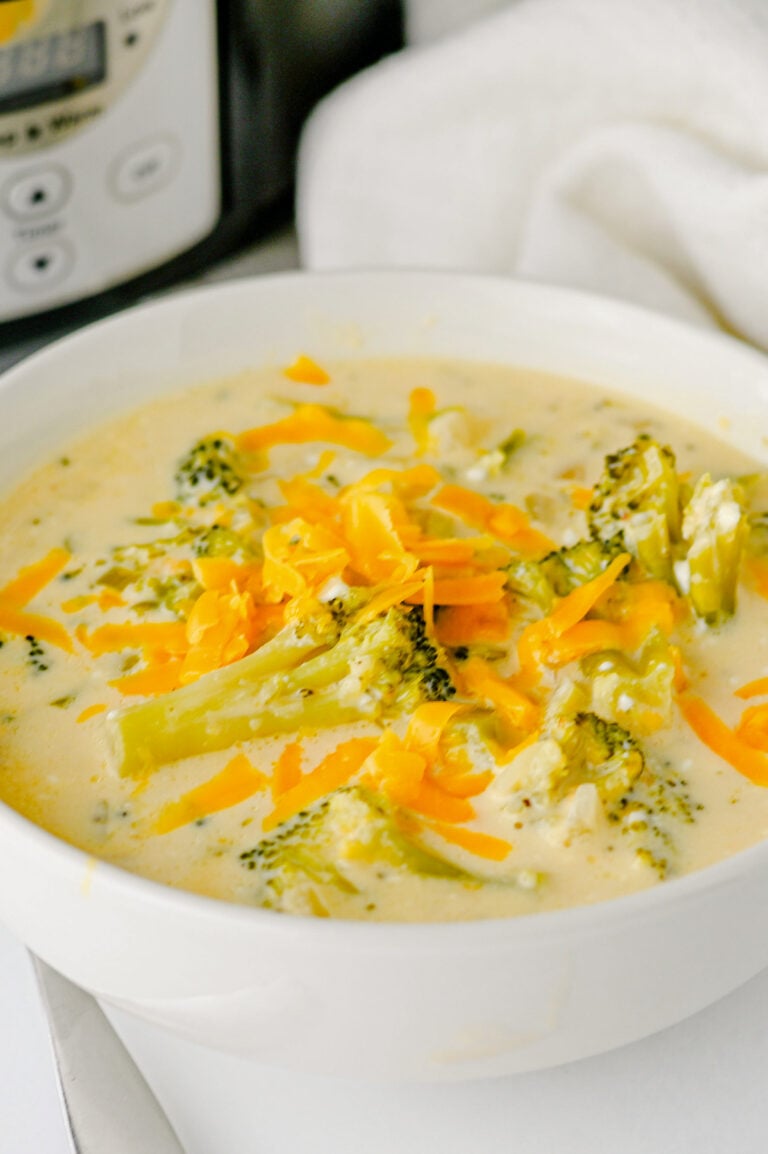 Broccoli cheddar soup in a white bowl.