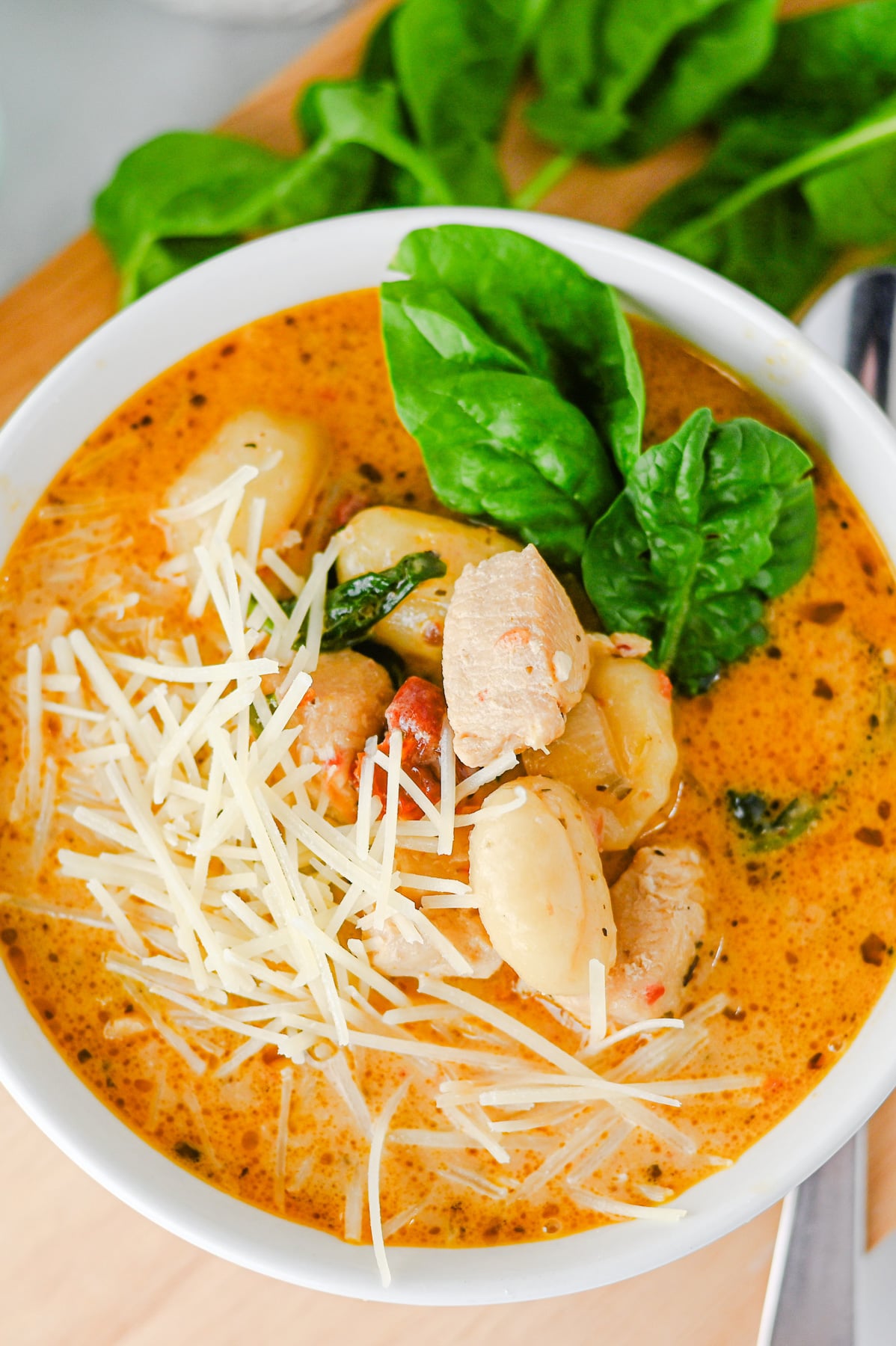 Marry me chicken gnocchi soup in white bowl ready to enjoy.