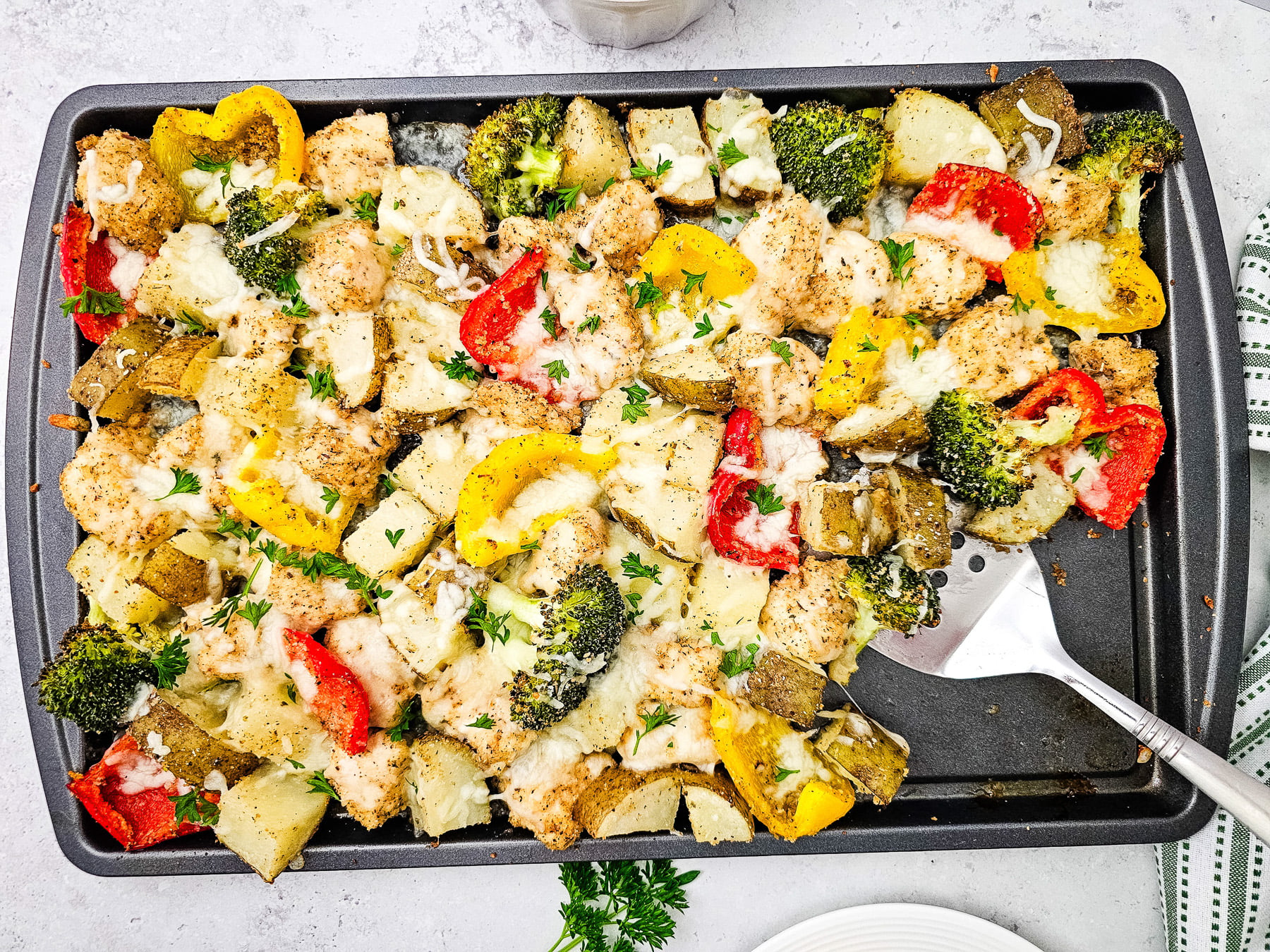 Shredded cheese is sprinkled on top then melted in oven, ready for serving.