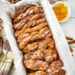 Apple cinnamon biscuit loaf in baking dish, ready to eat.