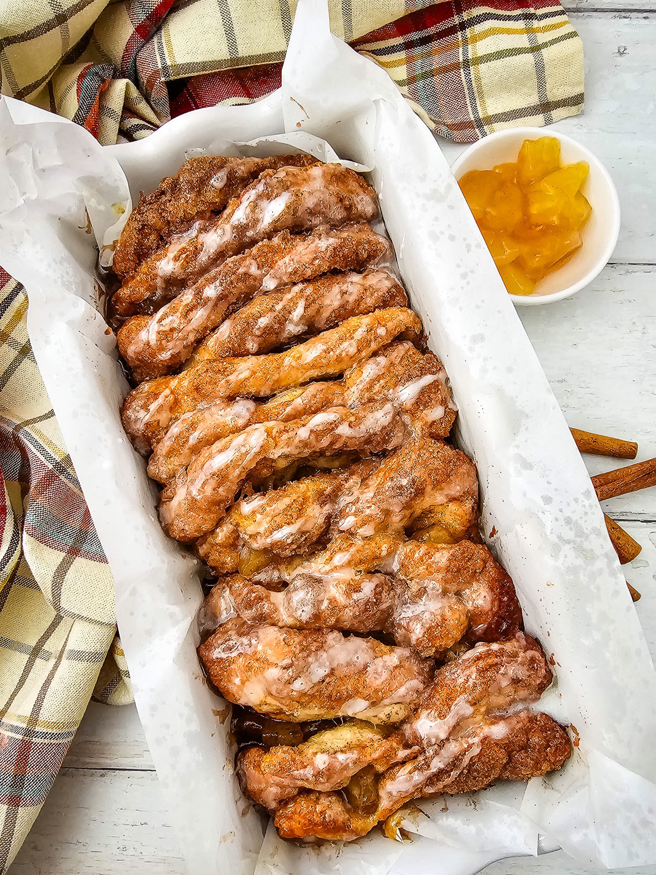 Apple cinnamon biscuit loaf in baking dish, ready to eat.