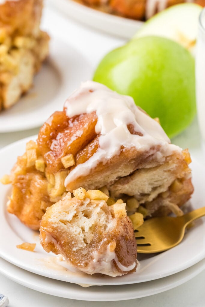 Apple cinnamon monkey bread on a white plate.