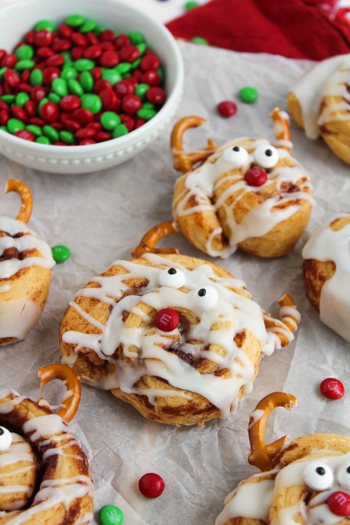 Completed cinnamon rolls reindeer on baking sheet.