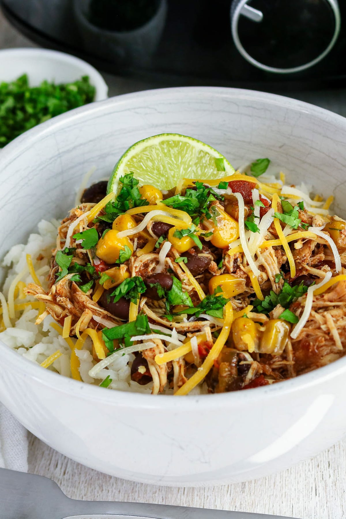 Crockpot southwest chicken in a white bowl.