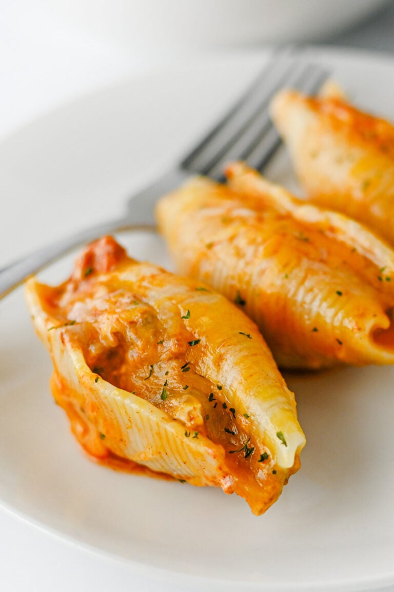 Mexican stuffed shells served on a white plate.