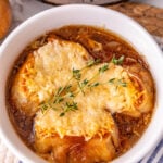 Crockpot French onion soup in soup bowl ready to eat.