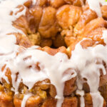 Apple cinnamon monkey bread on a white plate.