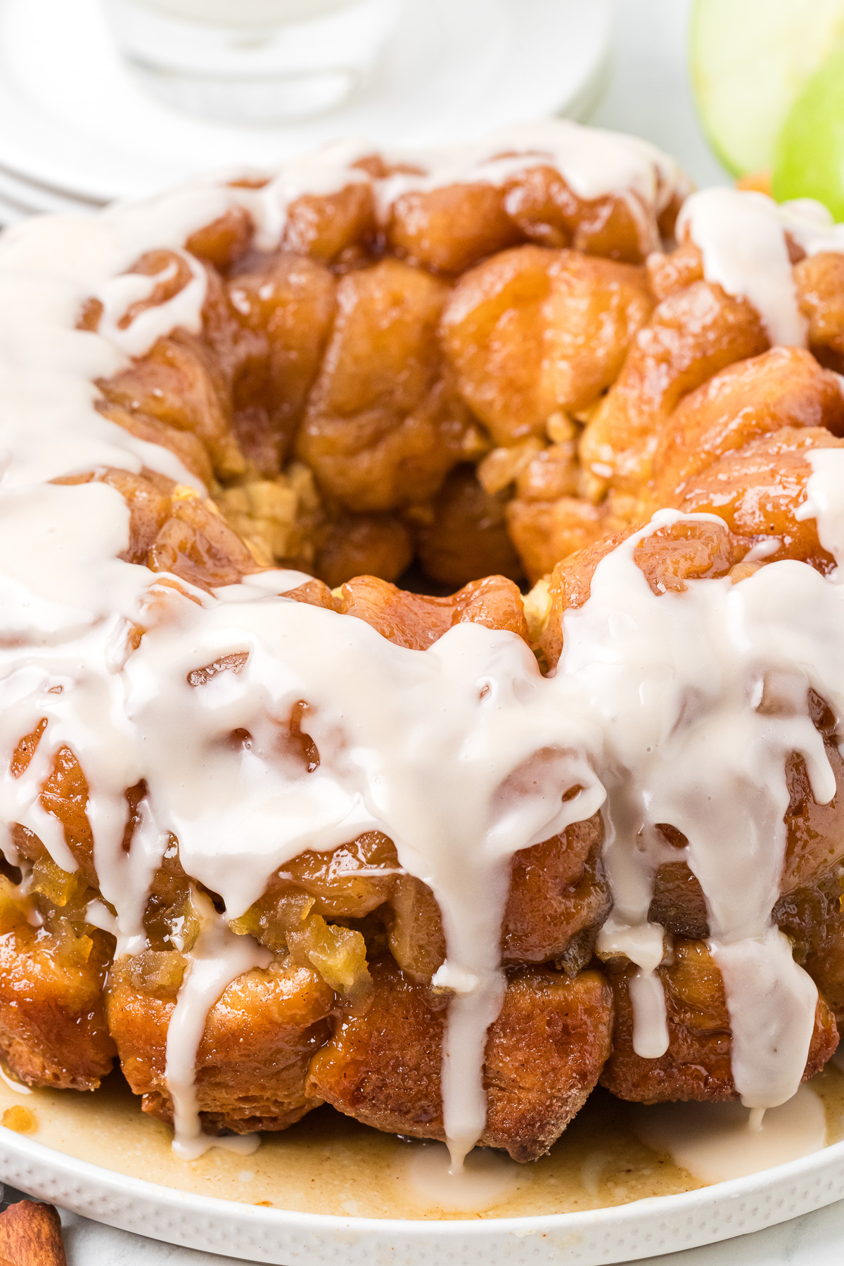 Apple cinnamon monkey bread on a white plate.