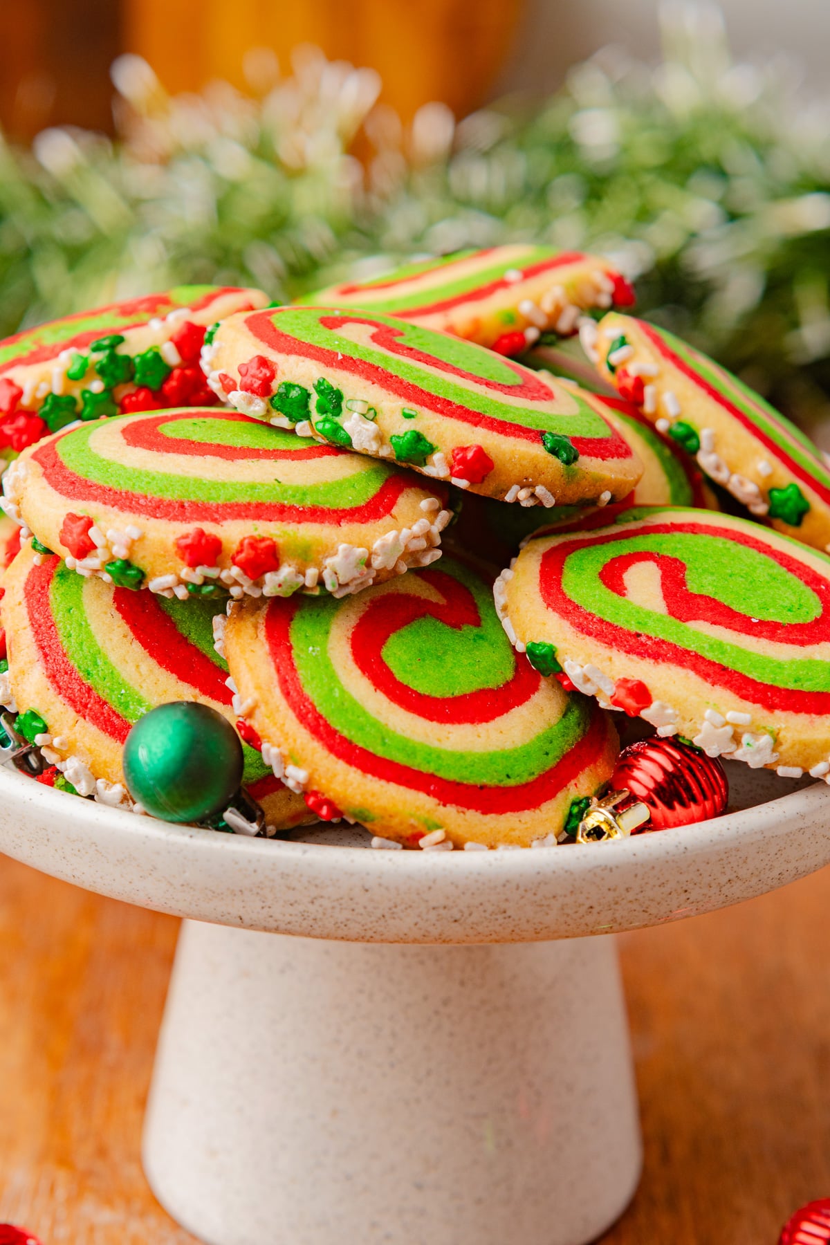 Cookies stacked on a holiday plate ready to eat.
