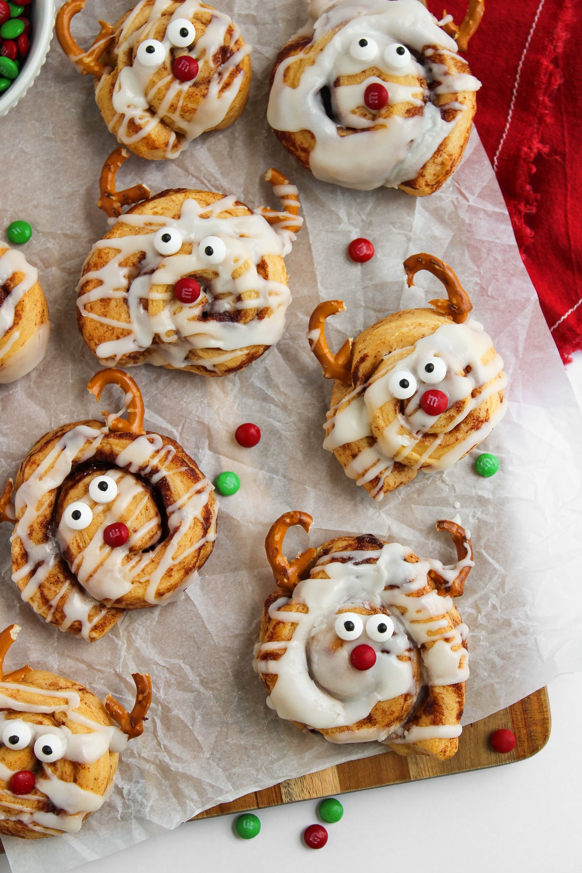 Reindeer cinnamon rolls completed and resting on baking sheet.
