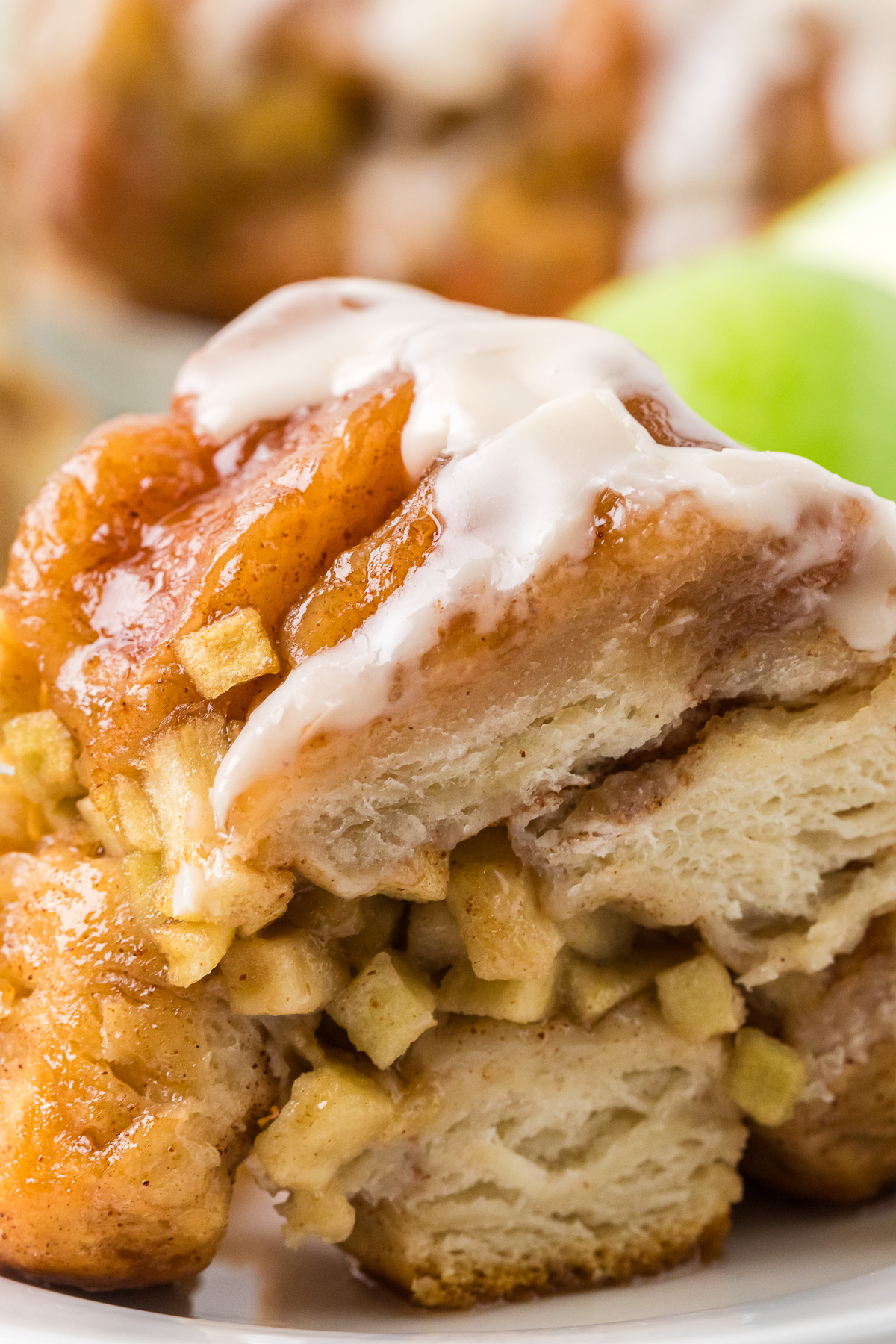 Apple cinnamon monkey bread on a white plate.