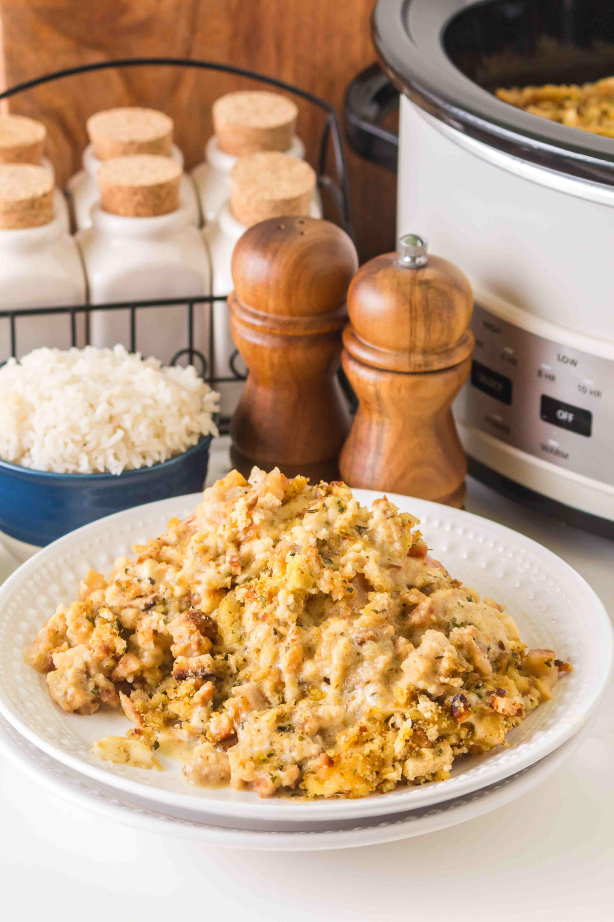 Crockpot chicken cordon bleu casserole served on a white china plate.