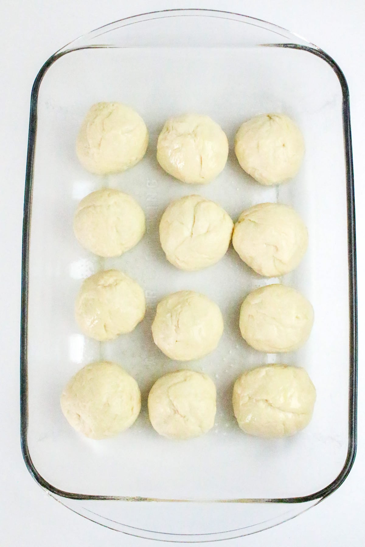 Dough is made into 12 portions in baking dish.