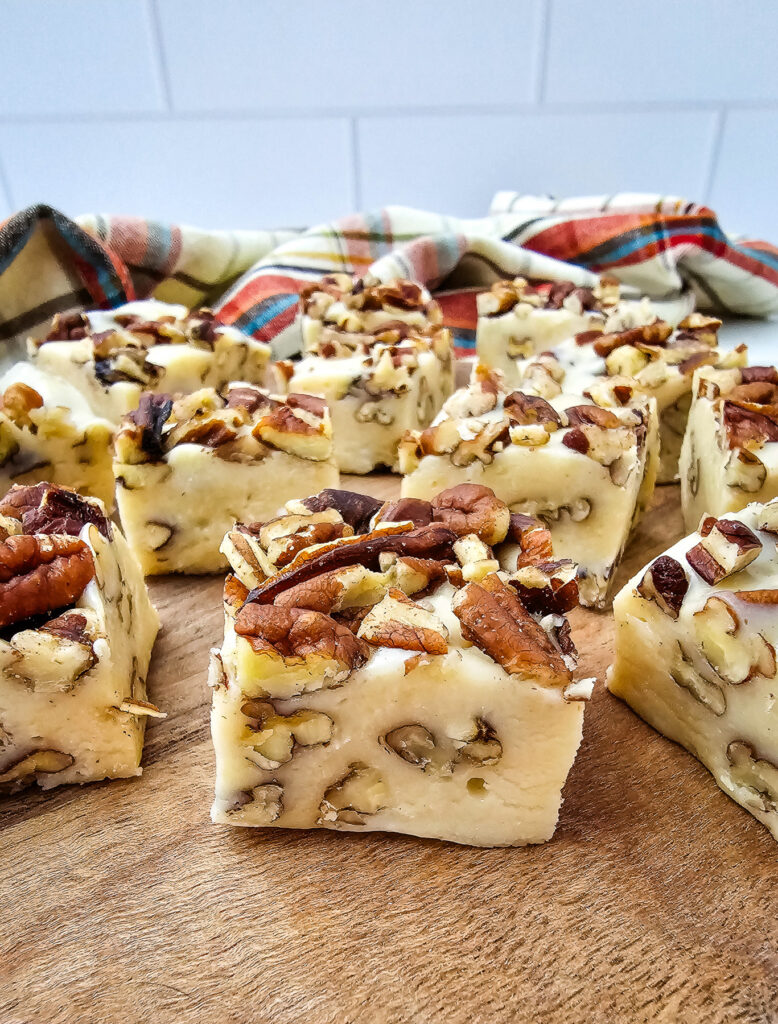 Pecan pie fudge on wooden board.