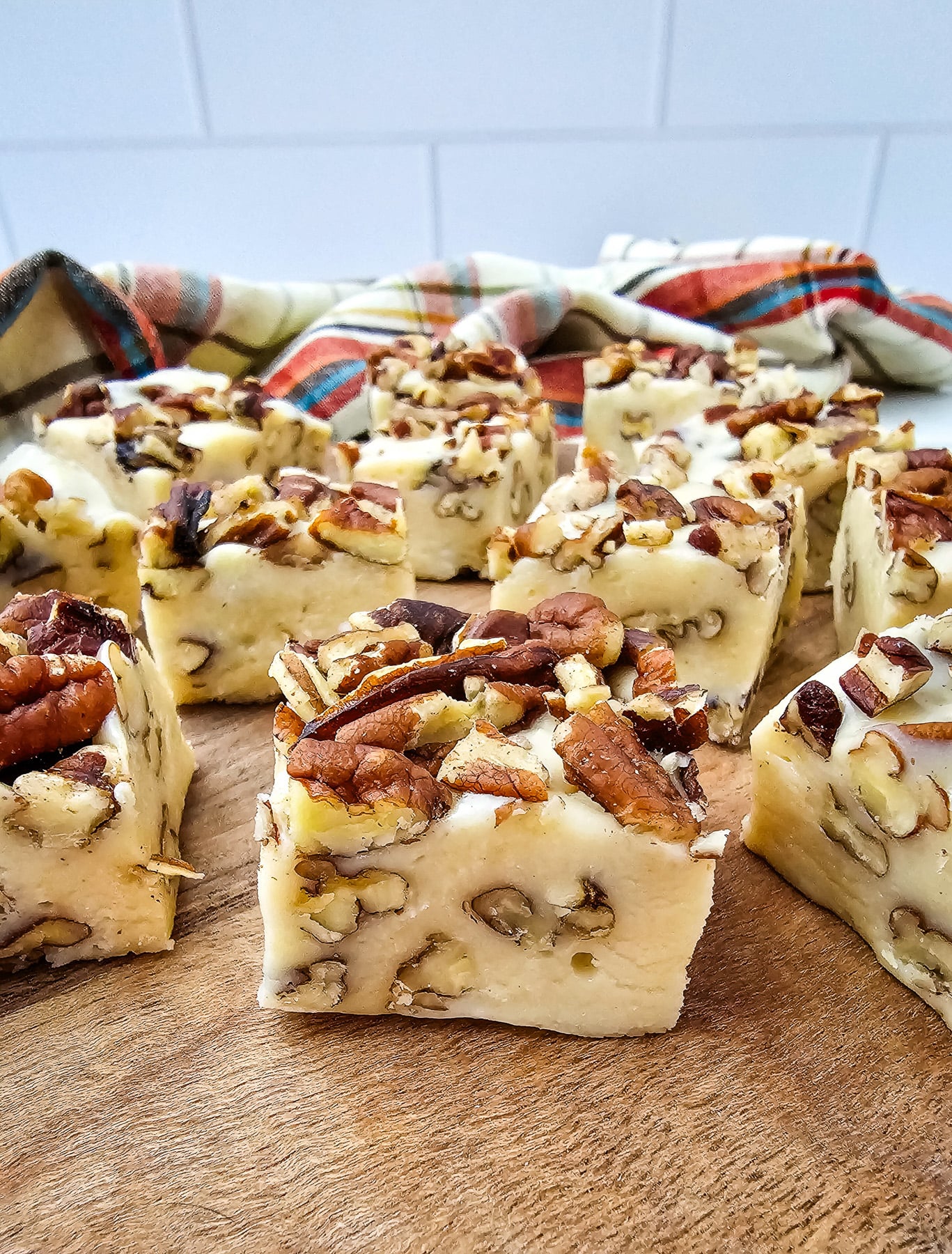 Pecan pie fudge on wooden serving board.