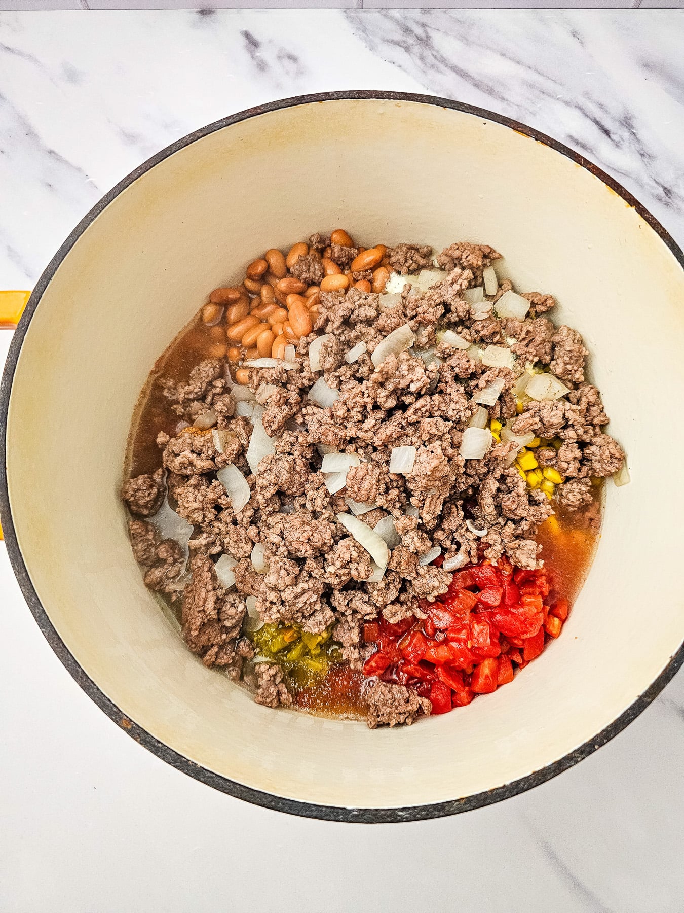 Remaining ingredients are added to the cooking pot.
