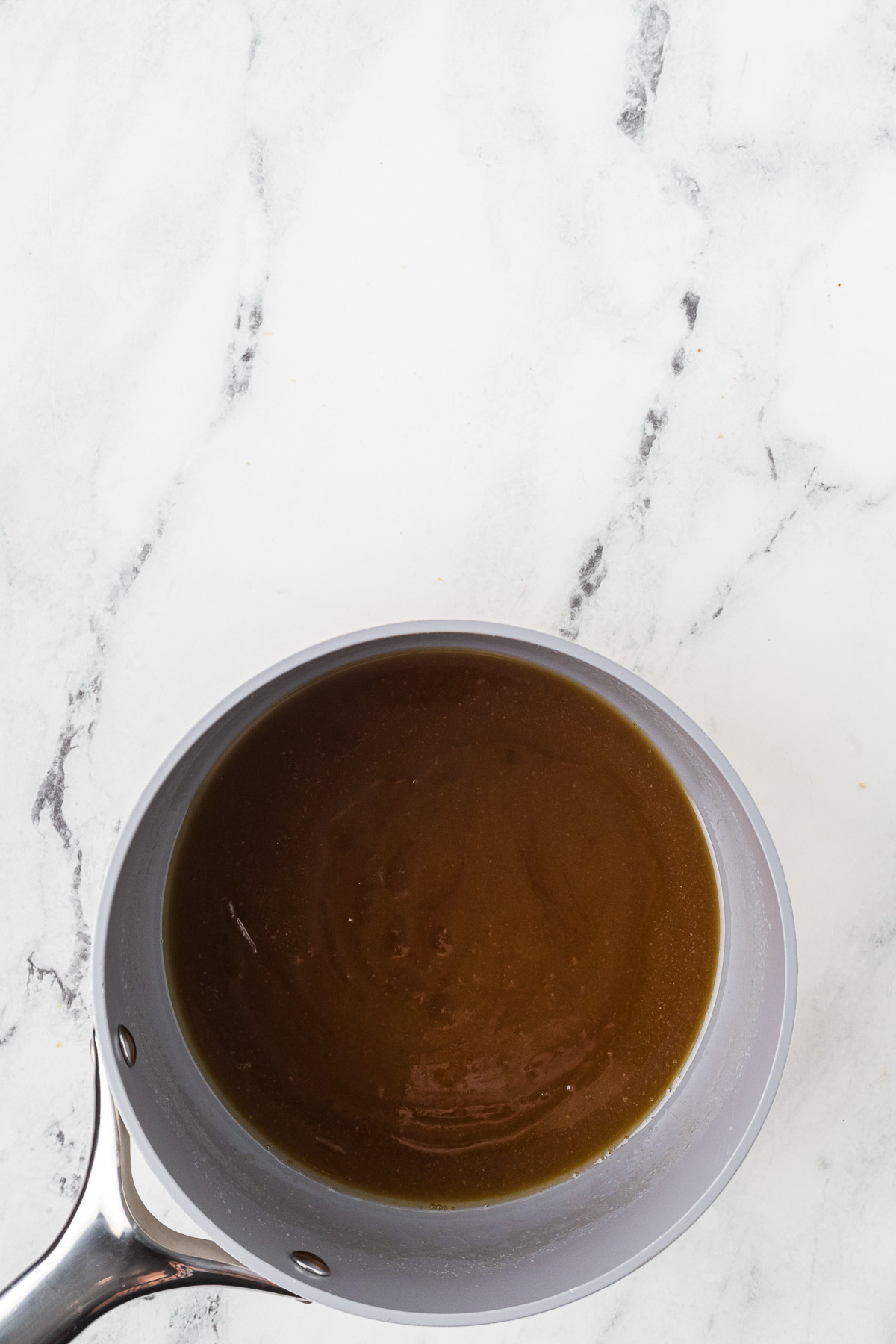 Melted butter in pan.
