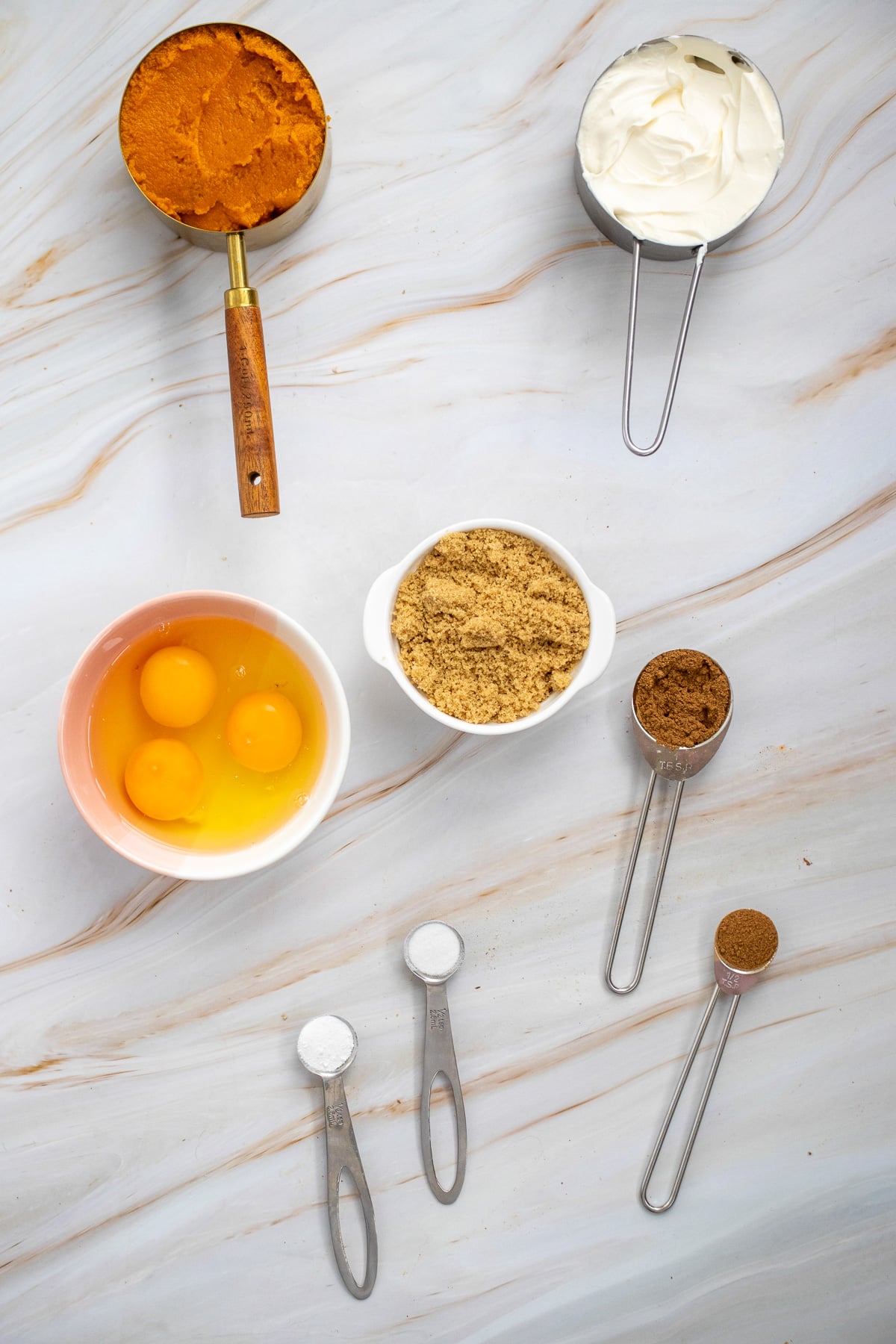 Pumpkin crisp ingredients laid out on kitchen counter in preparation for the recipe.