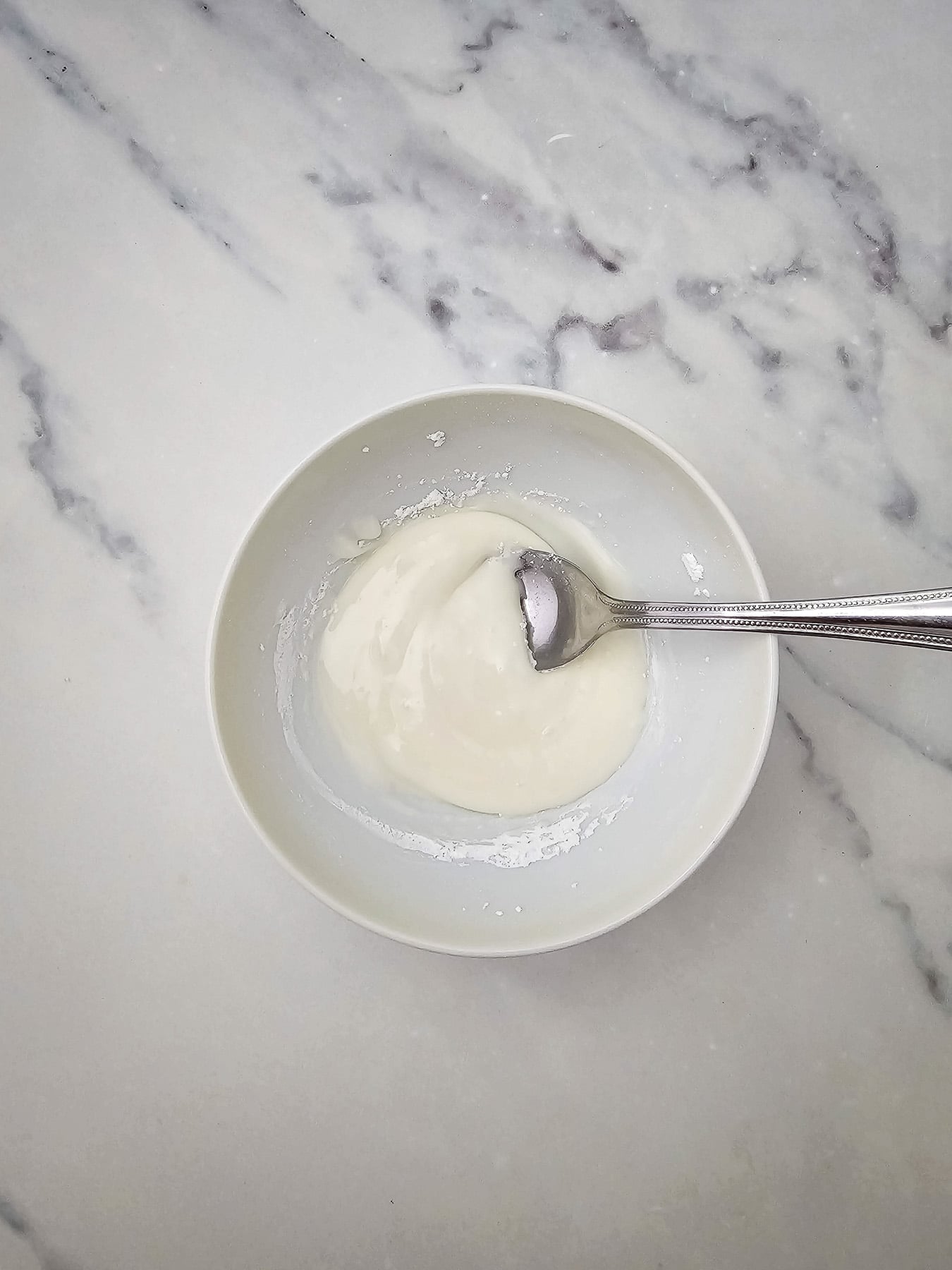 Icing mixed in bowl.