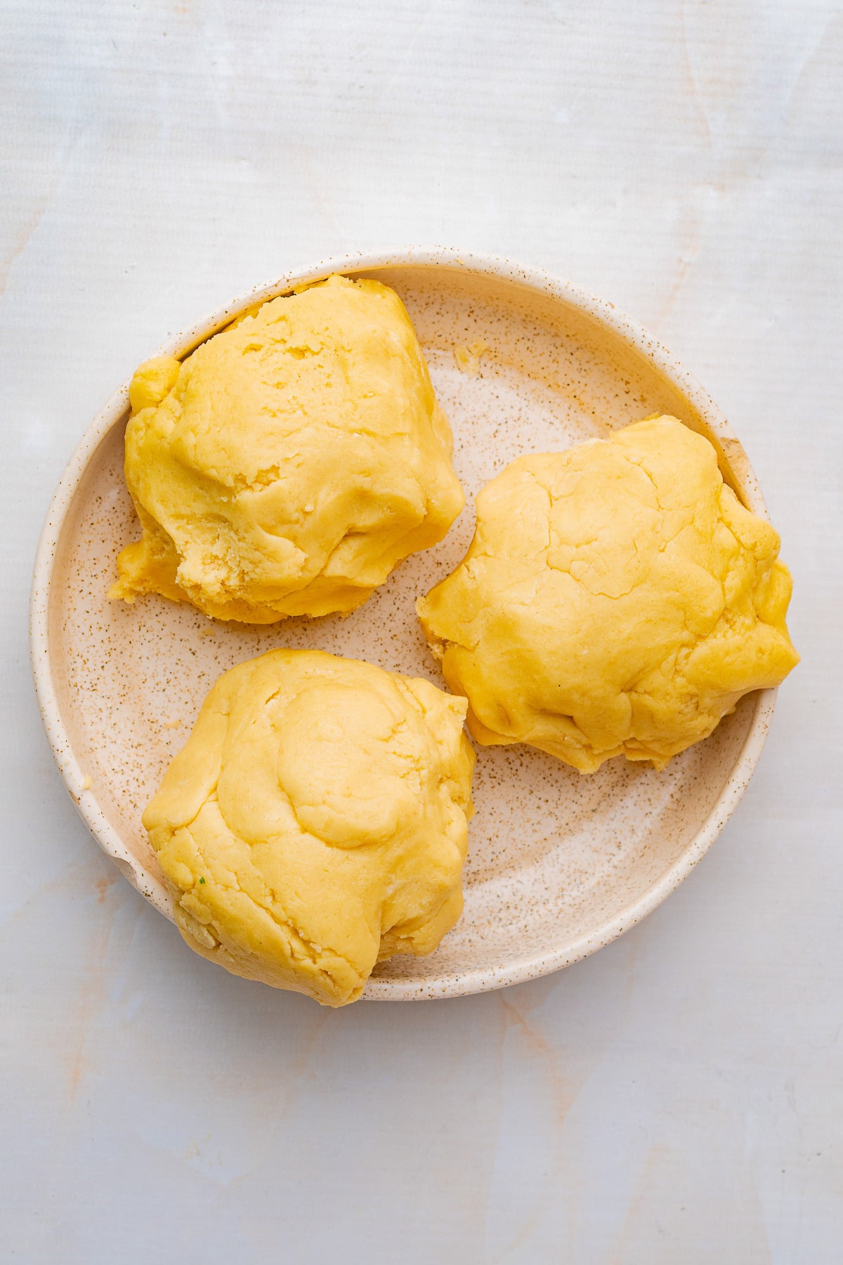Dough is divided into three balls.