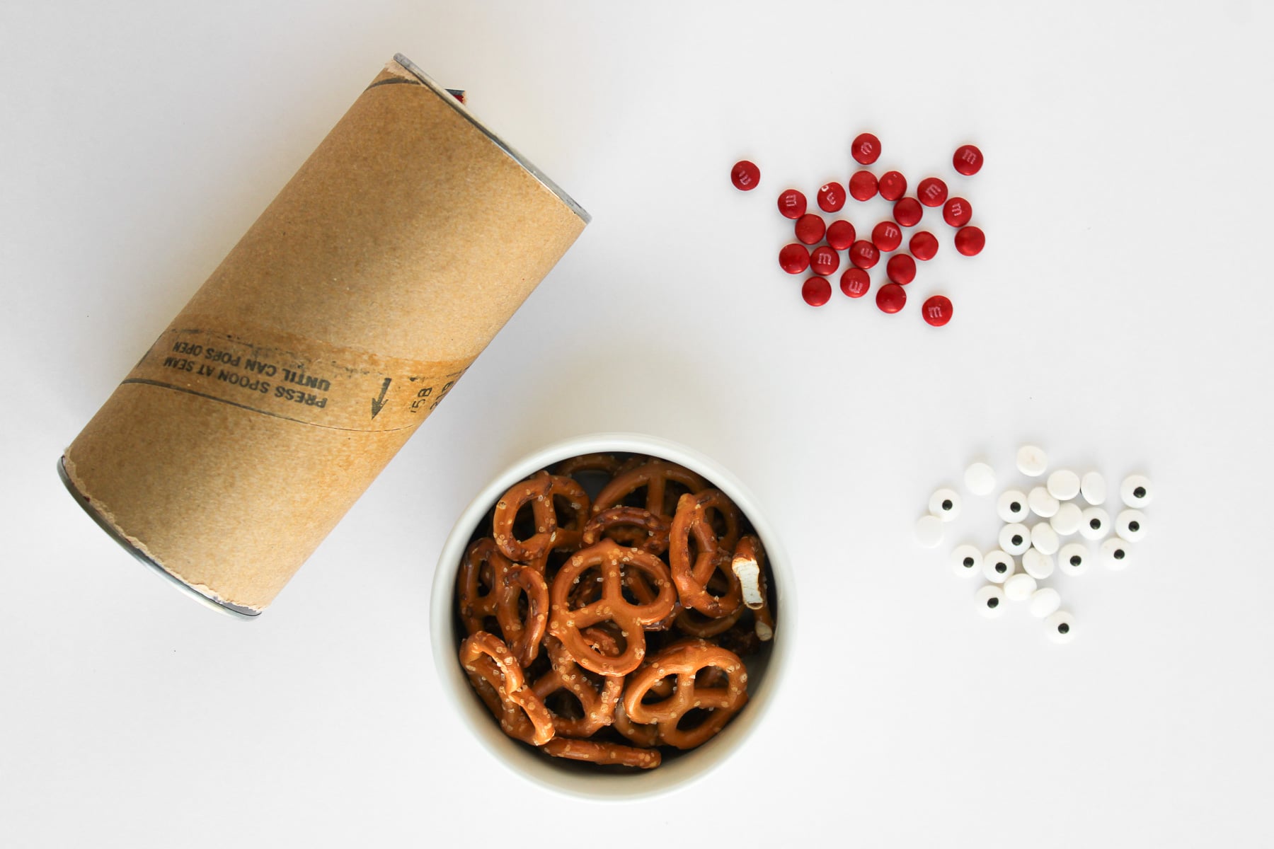 Ingredients for reindeer cinnamon rolls laid out in preparation on the kitchen counter.