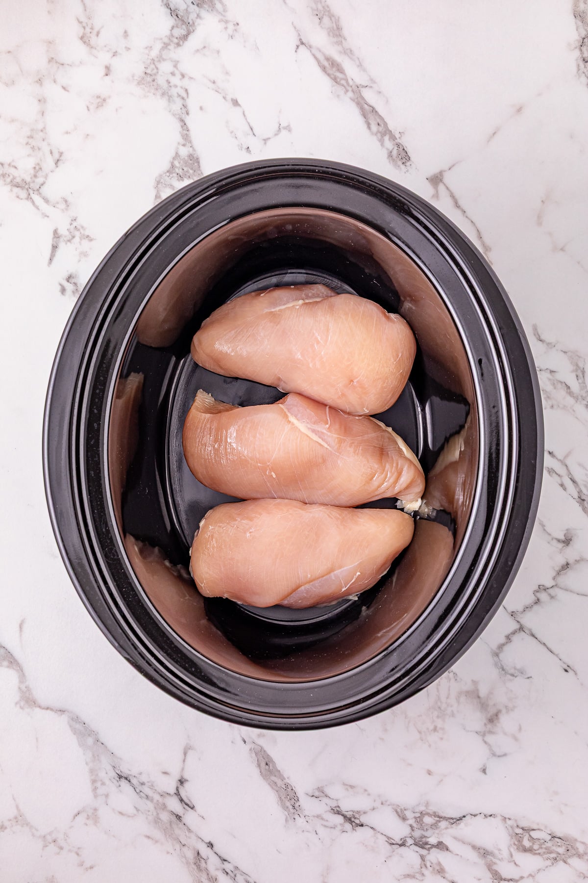 Chicken in the bottom of crockpot.