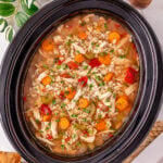 Crockpot beef barley soup in slow cooker ready to be served.