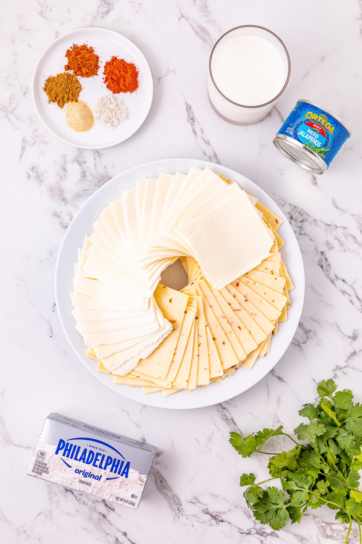 Ingredients for queso blanco laid out on counter in preparation for the recipe.