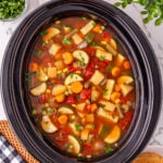Crockpot vegetable soup in slow cooker, ready to be served.