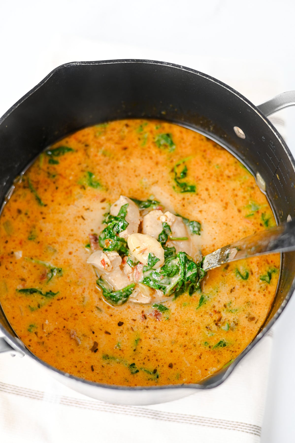Gnocchi is added to the pot then simmered.
