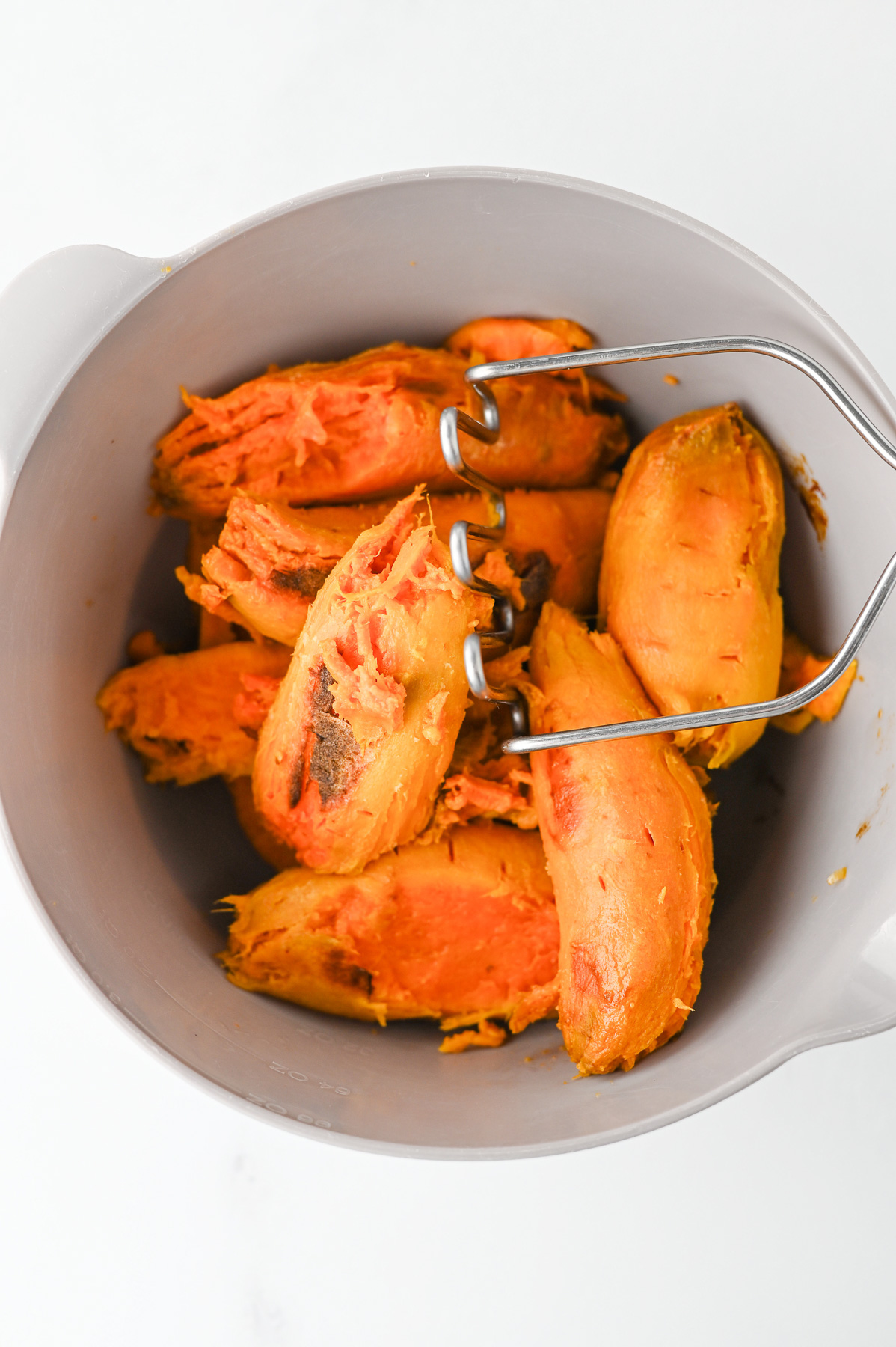 Mashed sweet potatoes in a bowl.