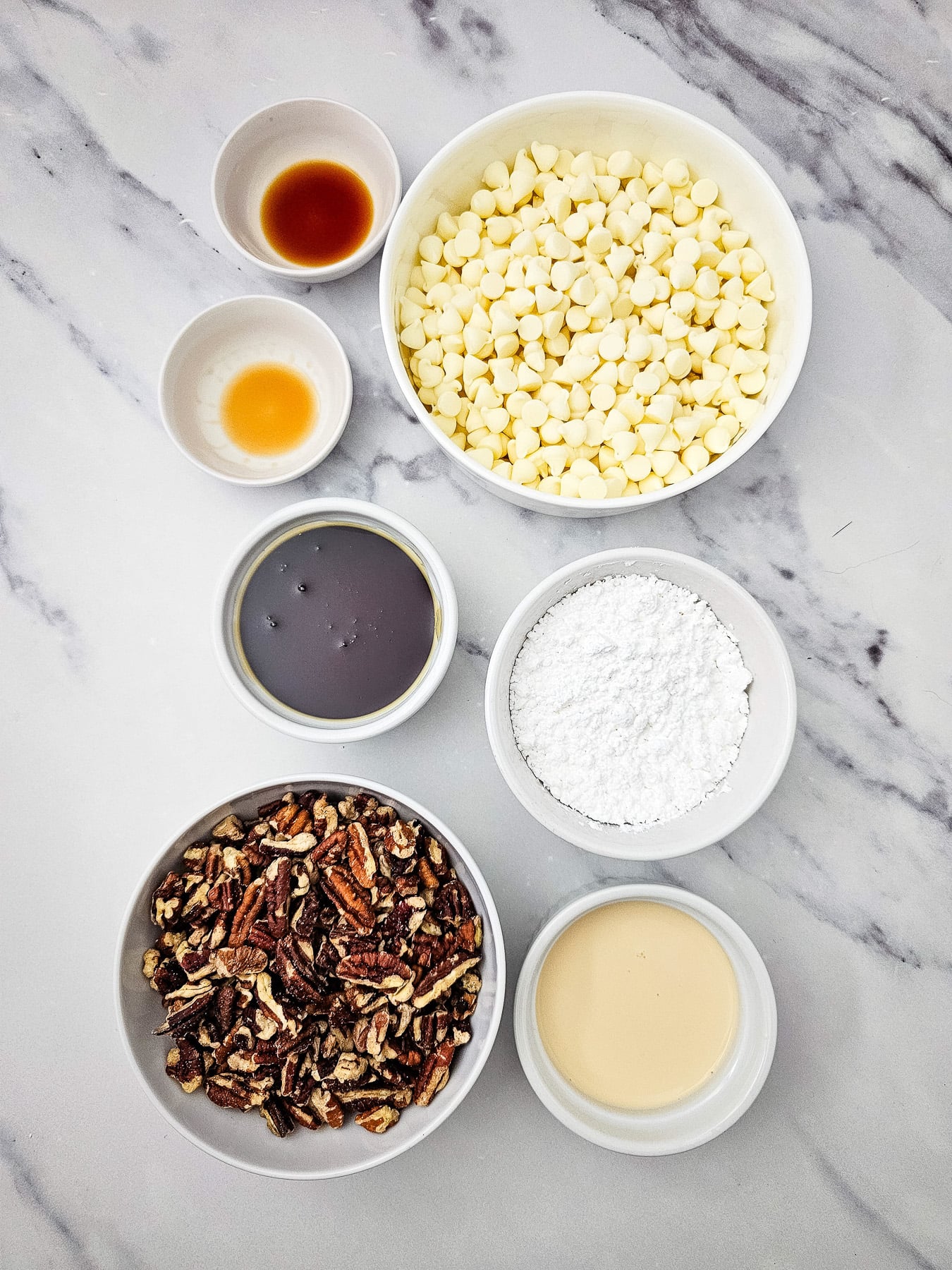 Pecan pie fudge in small bowls on counter.