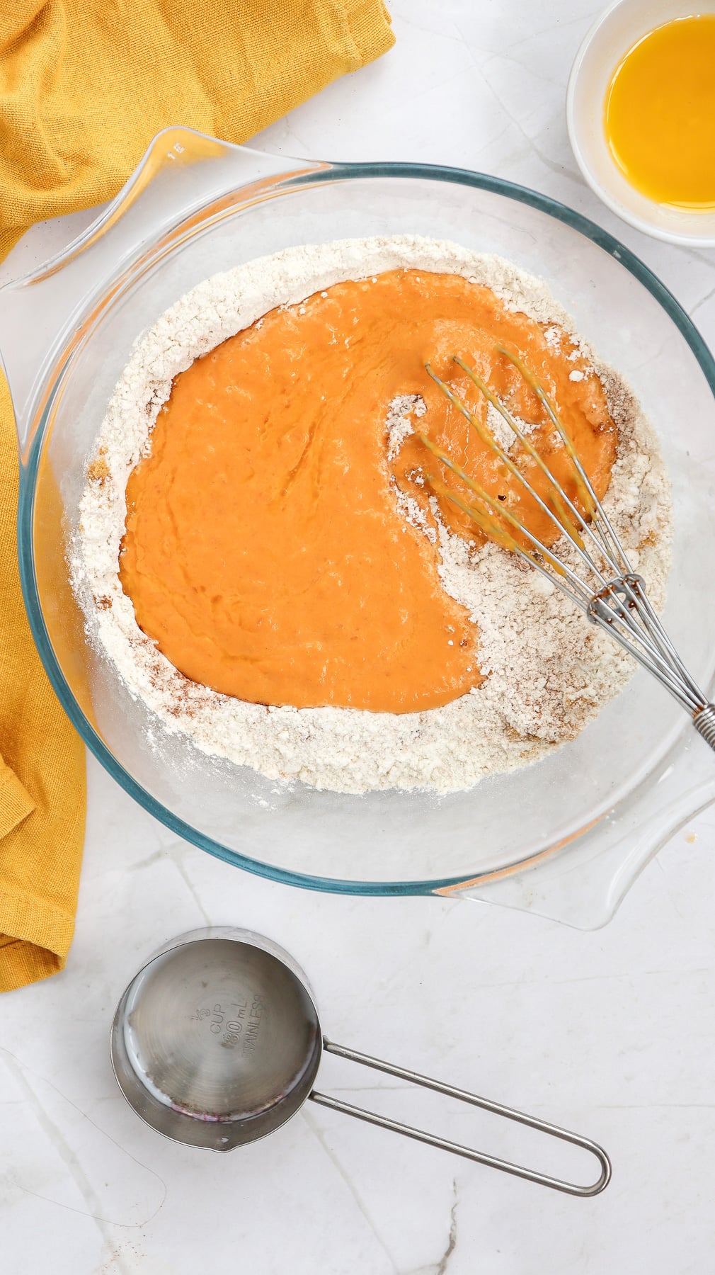 Pumpkin puree mixture is added to the dry ingreidents and stirred in.