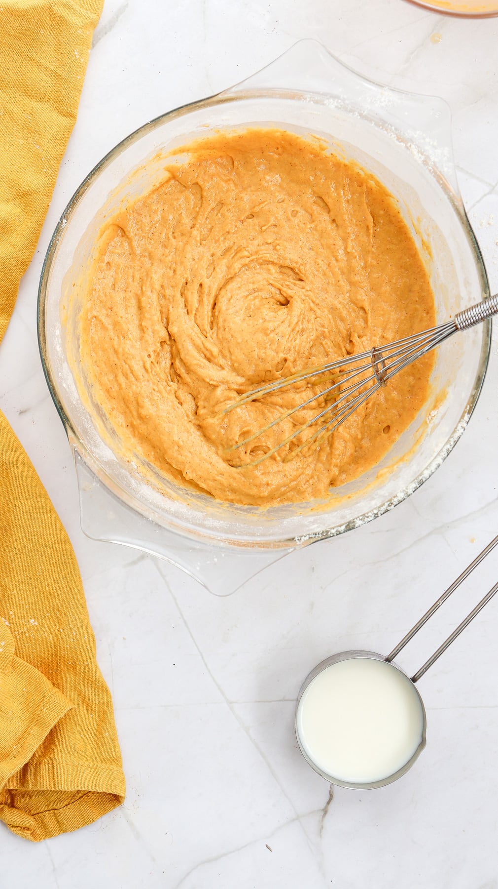 Pumpkin puree and egg mixture in bowl.