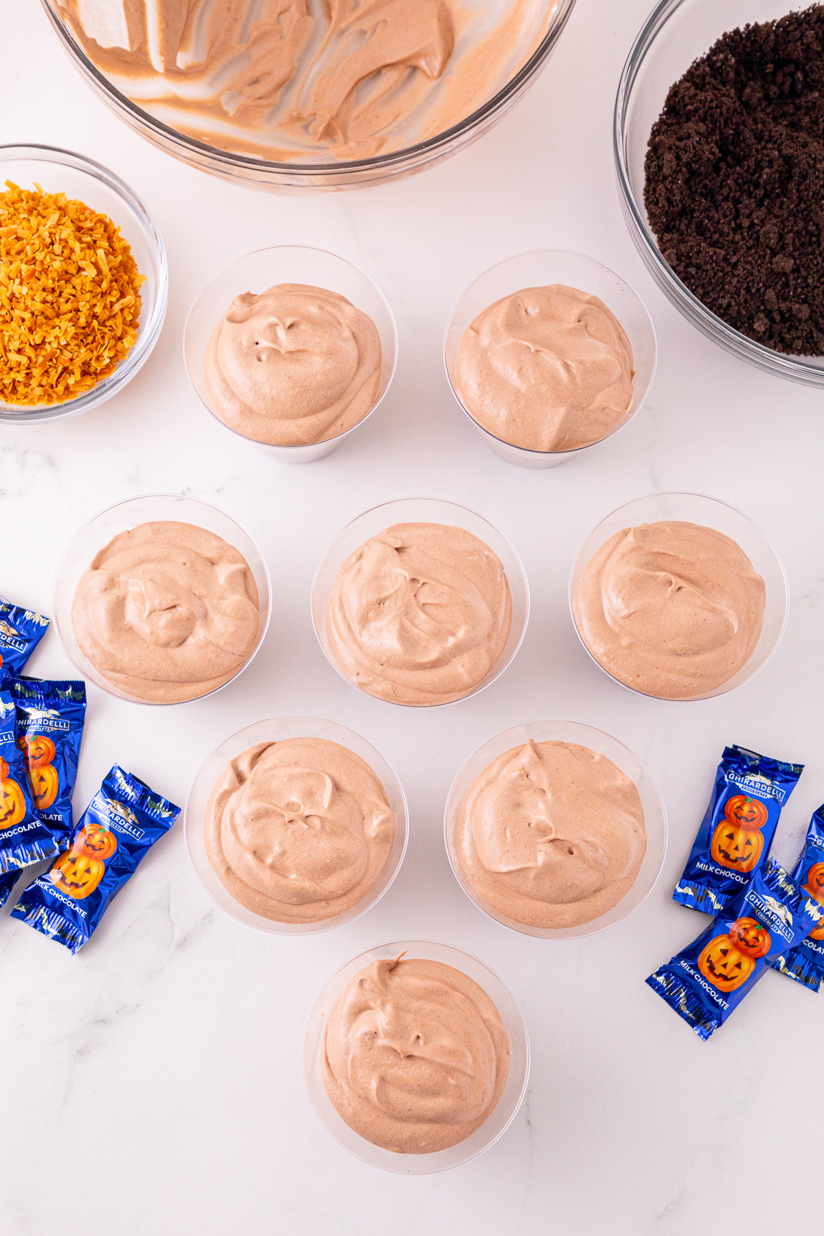 Prepared pudding in bottom of cups.