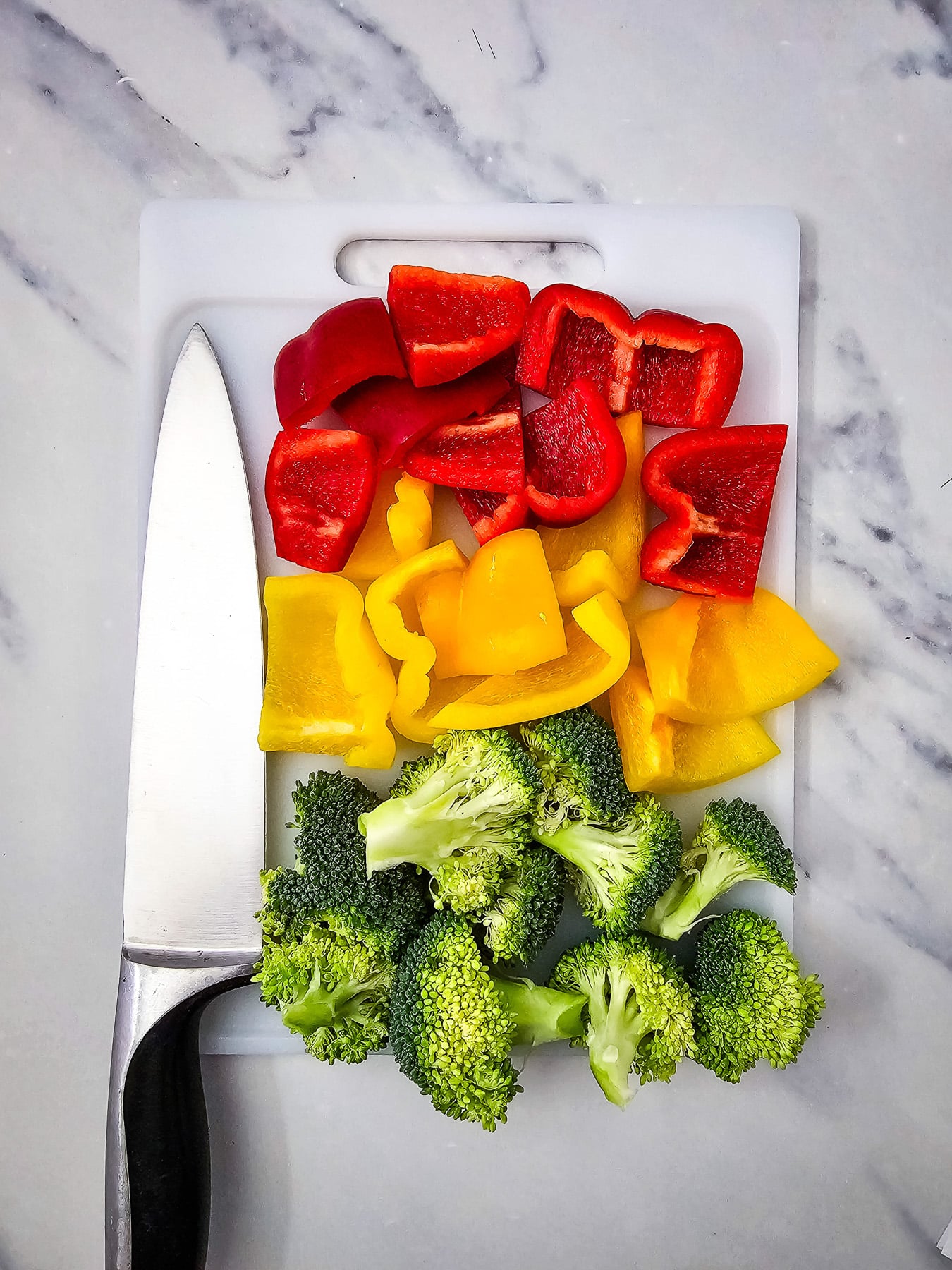 Chopped veggies on cutting board.
