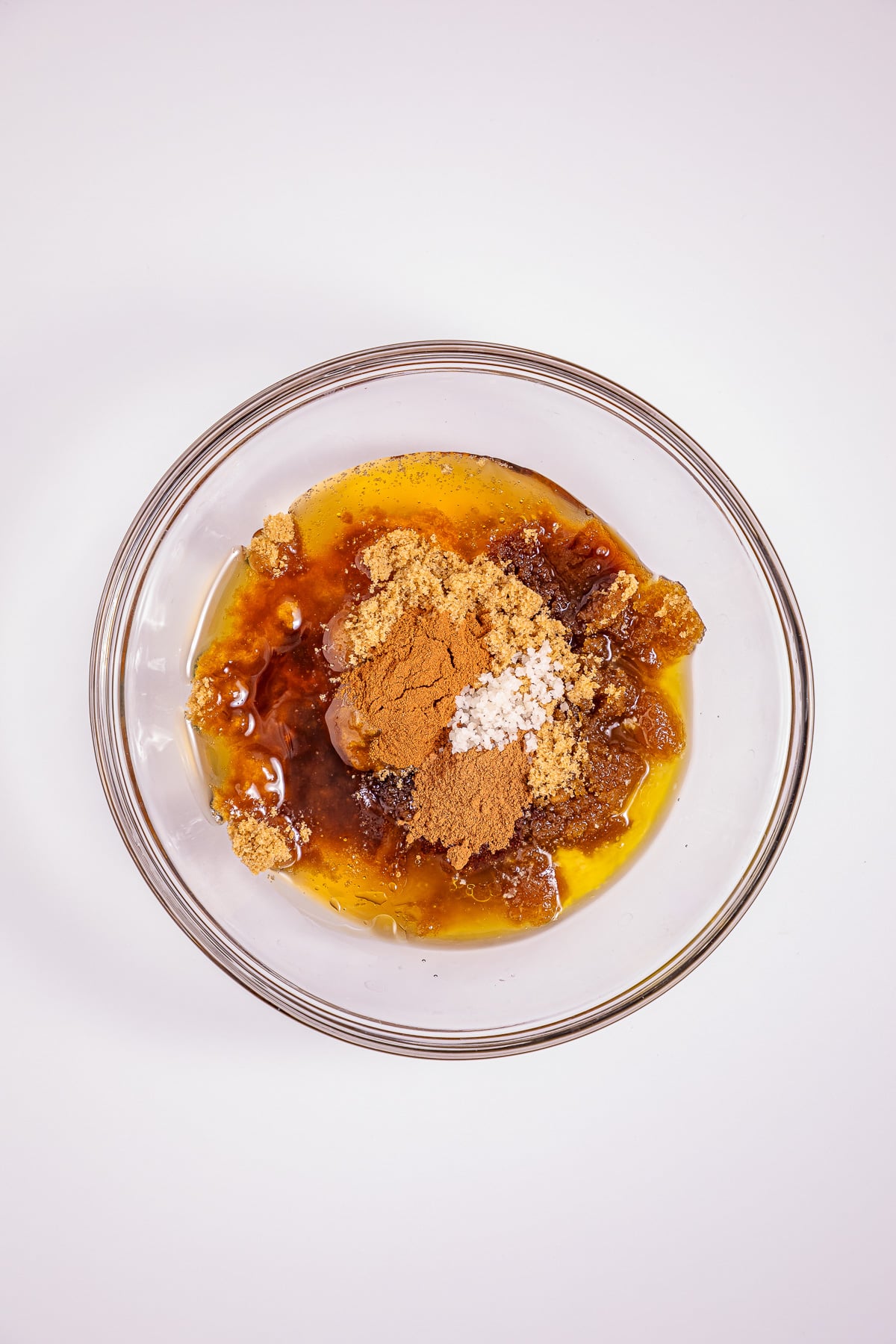 Brown sugar, honey or maple syrup, melted butter, water, vanilla extract, pumpkin pie spice, cinnamon and salt in mixing bowl.