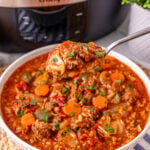 Crockpot cabbage soup in a white bowl.