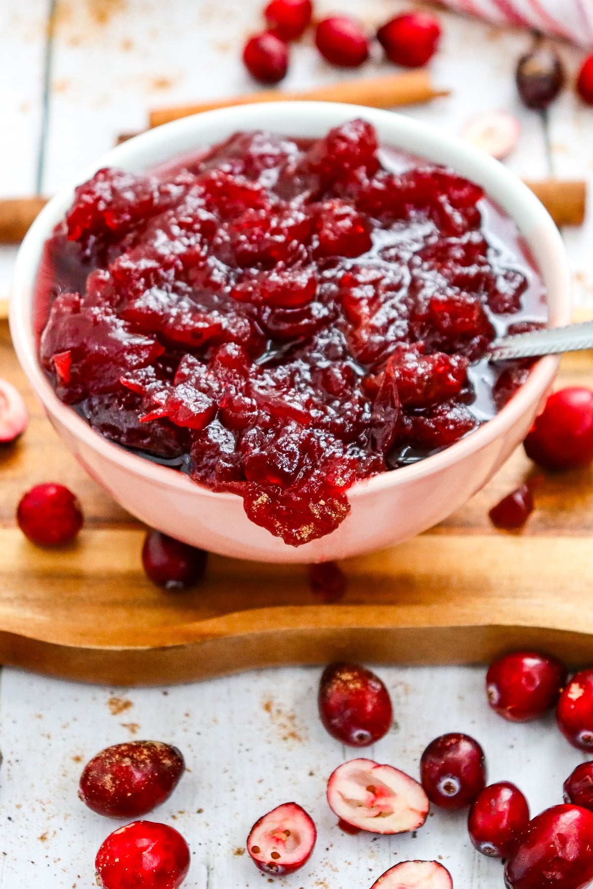 Cranberry sauce in white serving bowl.