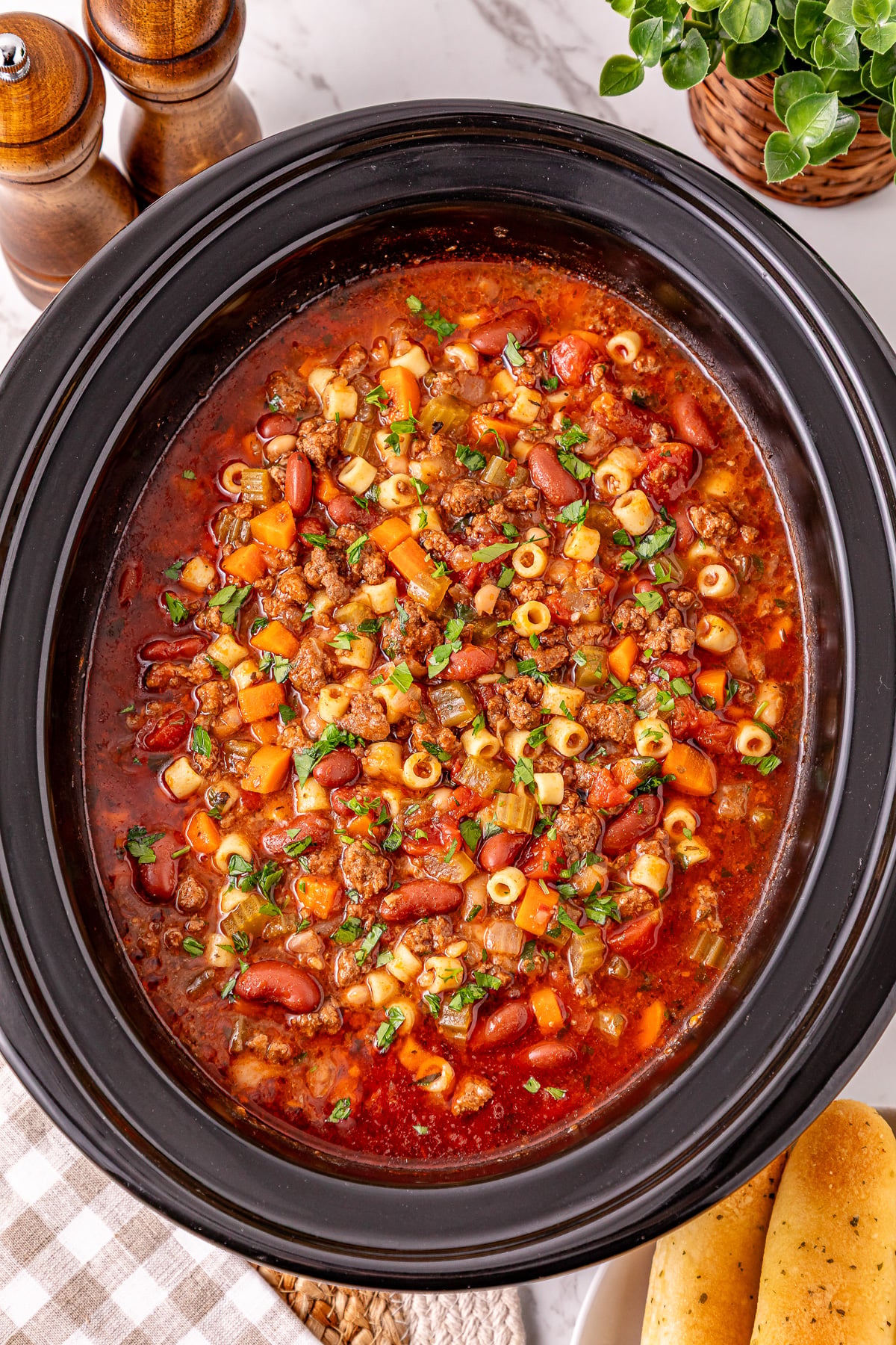 Pasta e fagioli soup in crockpot.