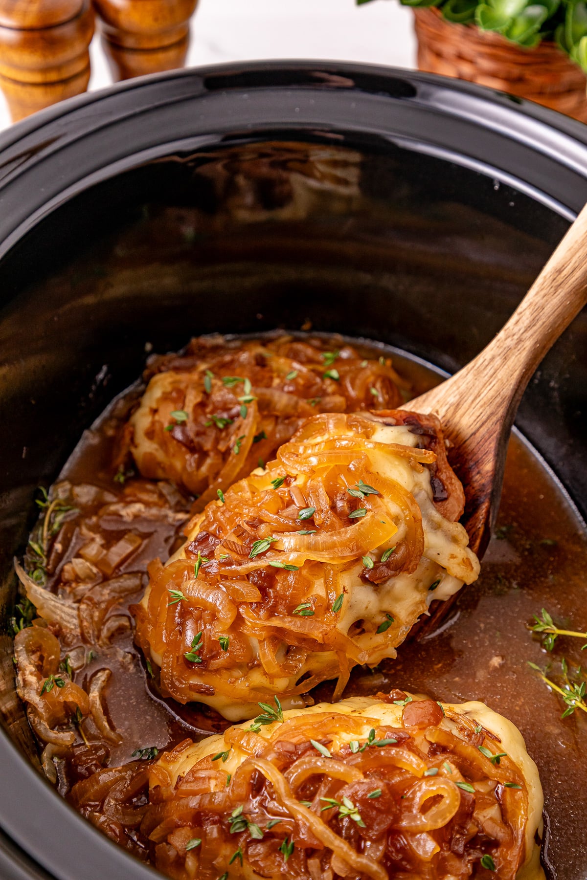 Crockpot french onion chicken in slow cooker ready to be served.