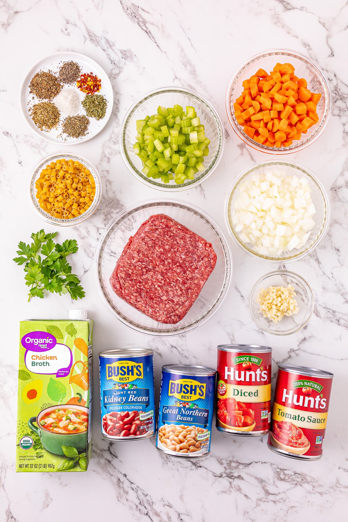 Ingredients for pasta e fagiole soup on kitchen counter in preparation for the recipe.
