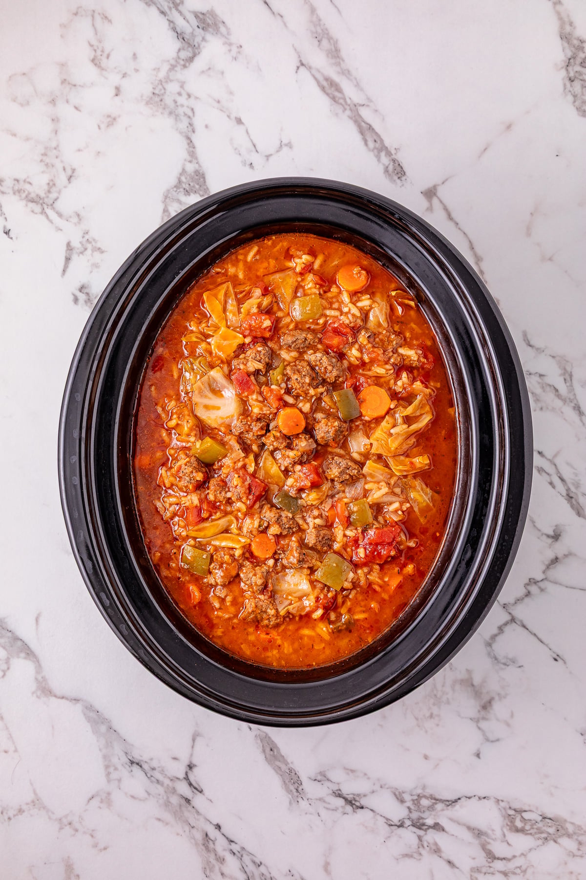 Beef broth and remaining ingredients are added to the crockpot.