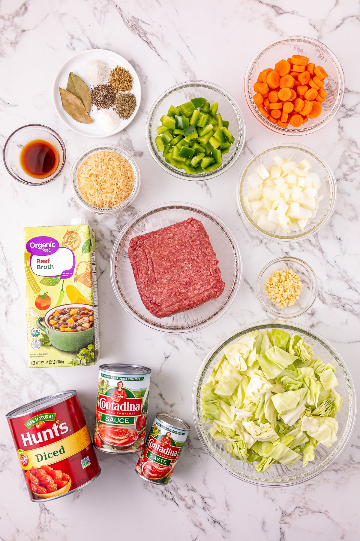 Ingredients for slow cooker cabbage roll soup laid out on kitchen counter in prepration for the recipe.